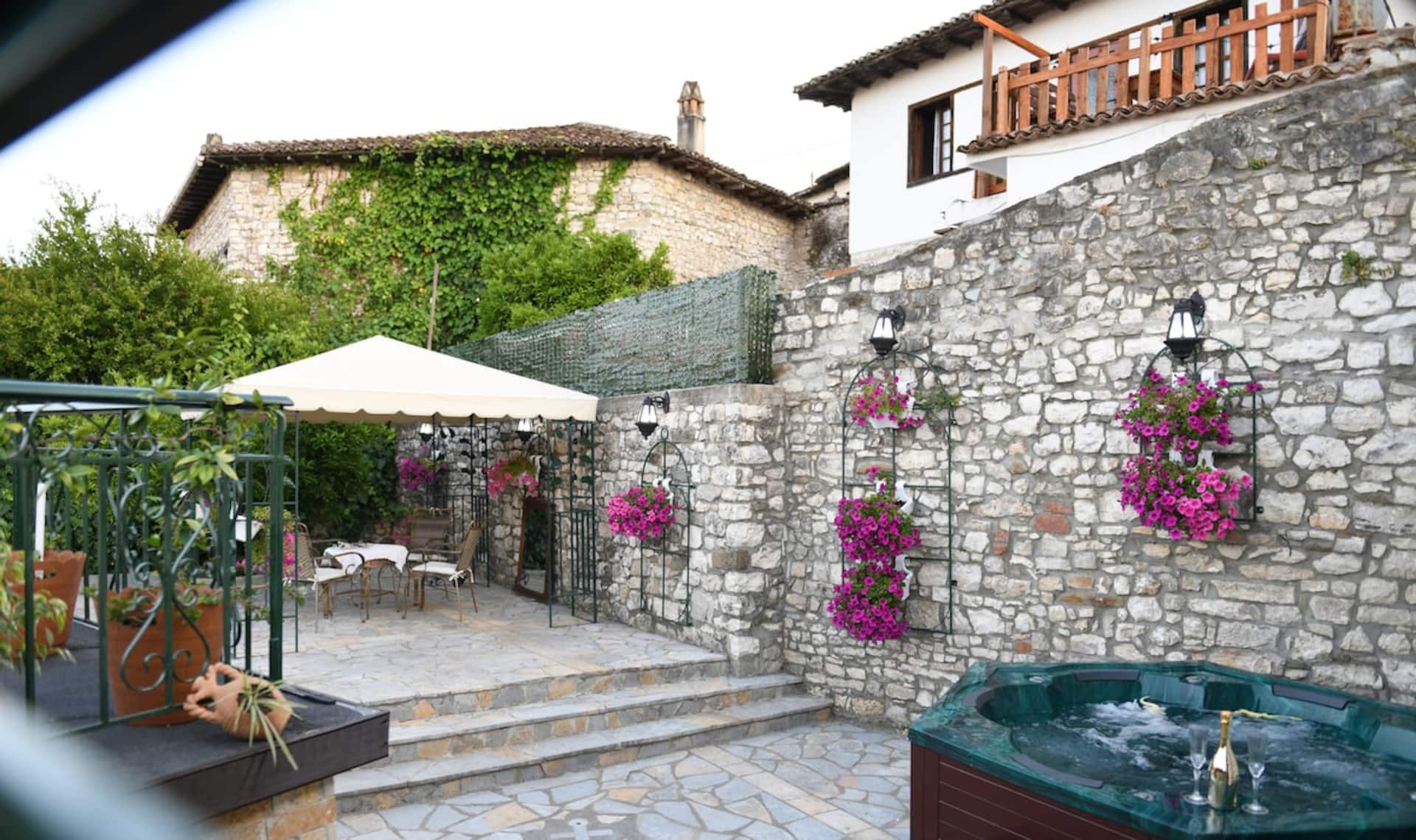The stone courtyard and garden of Sokaku Monark inside Berat Castle